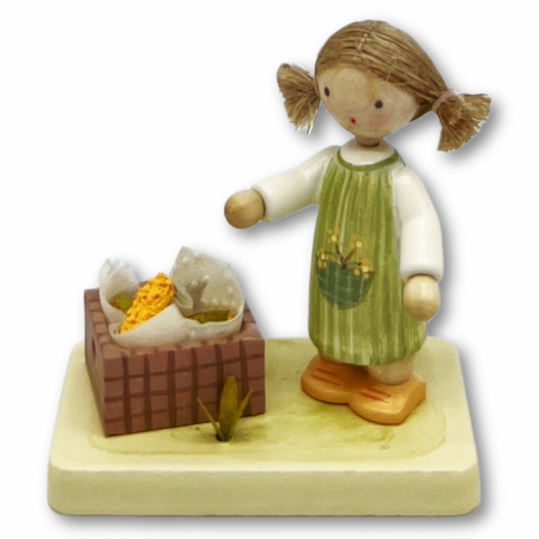 Mädchen mit Maiskolben