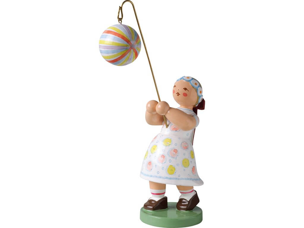 Mädchen mit Kugellampion gestreift
