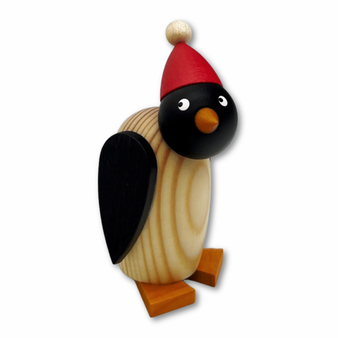 Pinguinkind mit roter Mütze