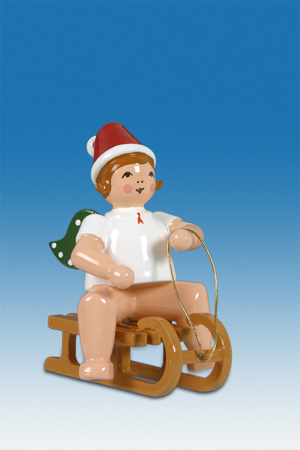 Weihnachtsengel auf Schlitten sitzend mM