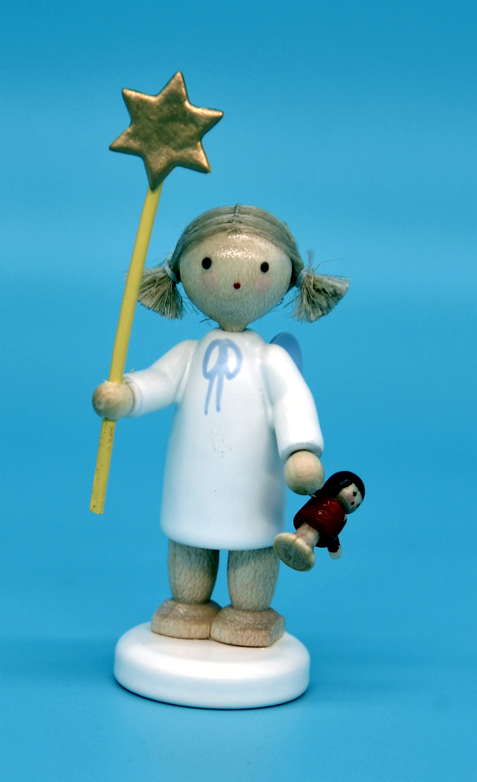 Engel mit Stern und Puppe