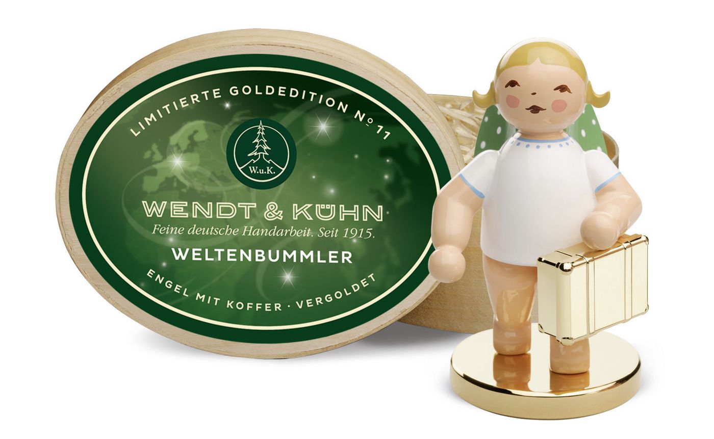 No. 11, Weltenbummler, Engel mit Koffer auf Metallsockel · vergoldet, in Spanschachtel. Limitierte Goldedition (22.222 Stück)